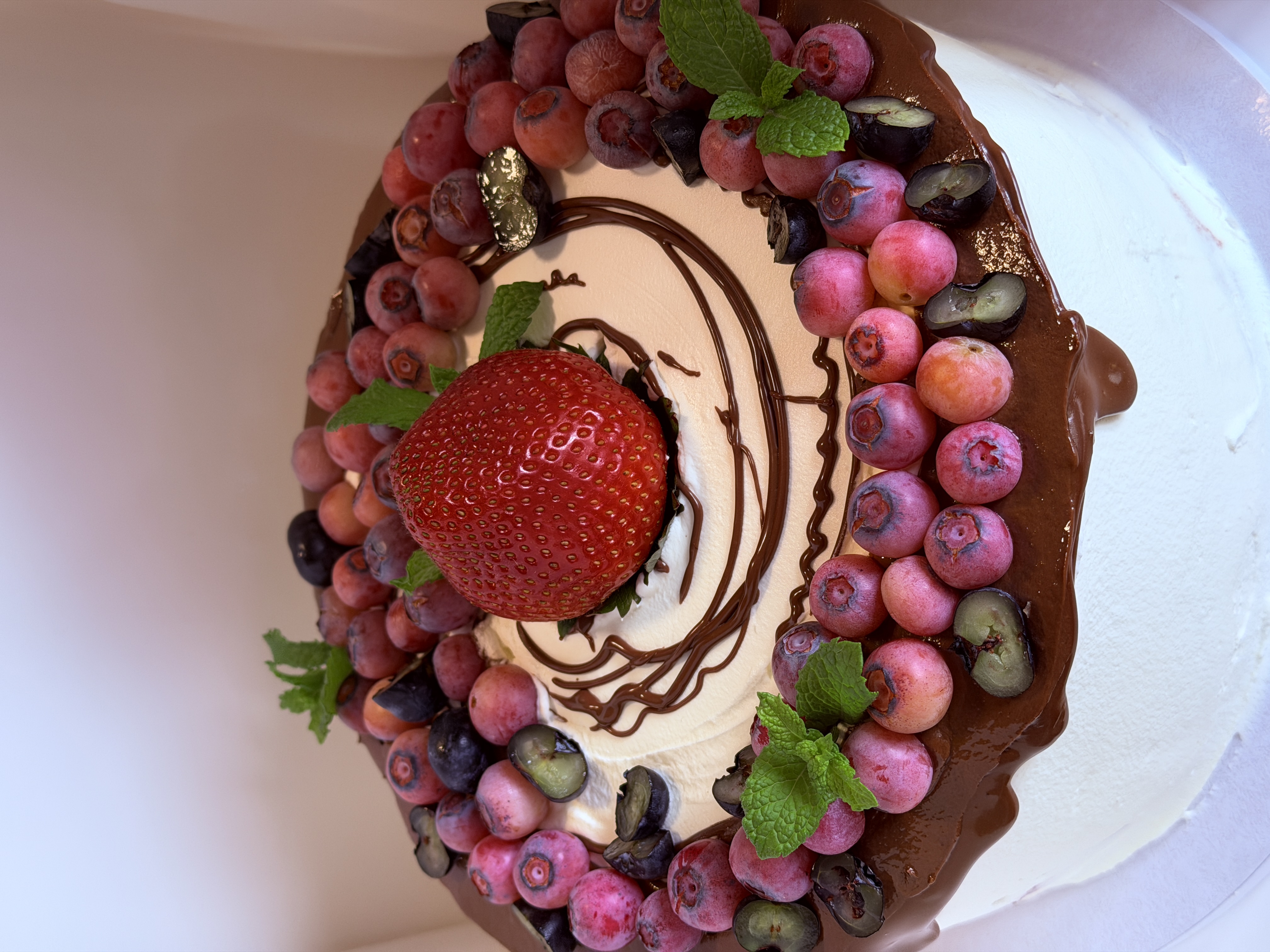 Berry and strawberry cake, overhead view